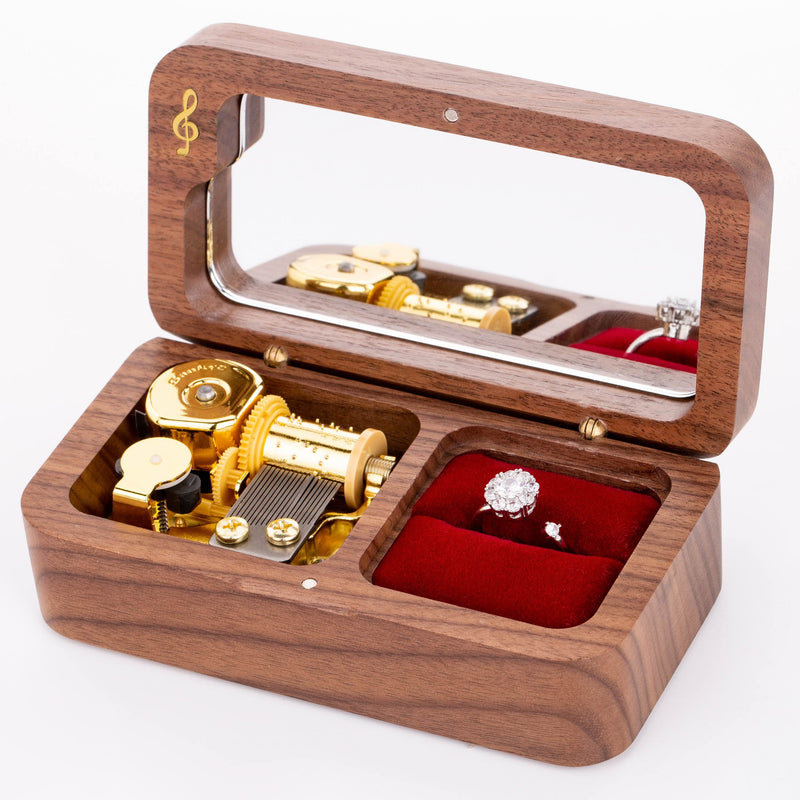Wooden music box used as an elegant ring box